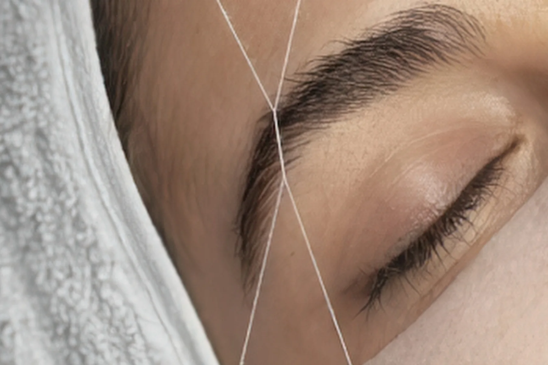 Professional facial threading treatment imagery for Eyebrow Threading